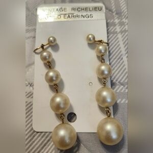 Vintage Richelieu faux pearl earrings with a screw-back  clip-on closure. Signed